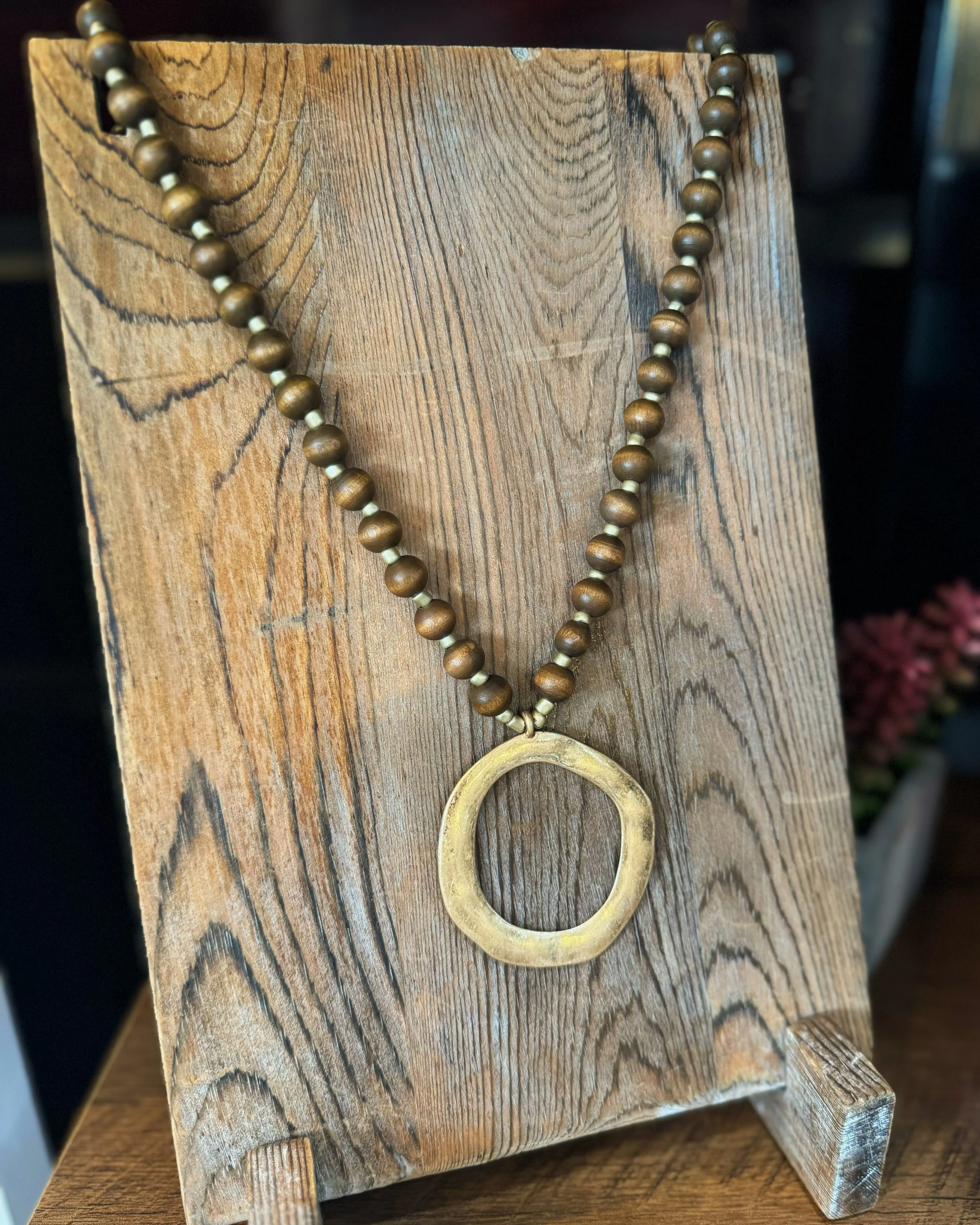 Dark Brown Beaded Necklace with Circle Pendant